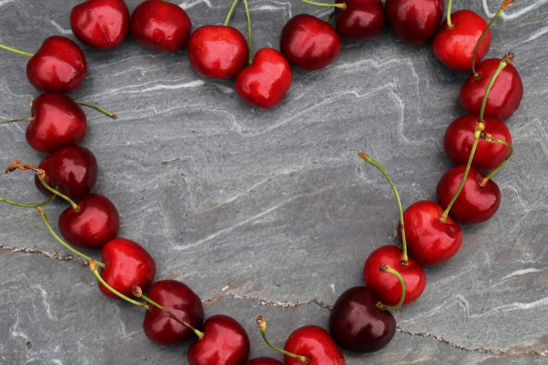 Fresh cherries in a heart shape